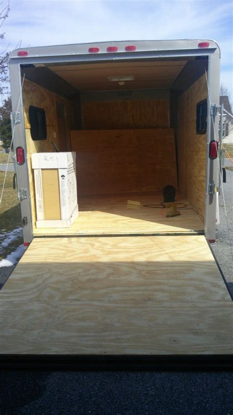 Woman Converts Cargo Trailer Into Stealthy And Cozy Off Grid Rv