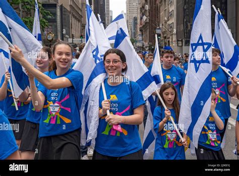 New York New York May 22 Participants Holding Israeli Flags And Signs March Up Fifth Avenue