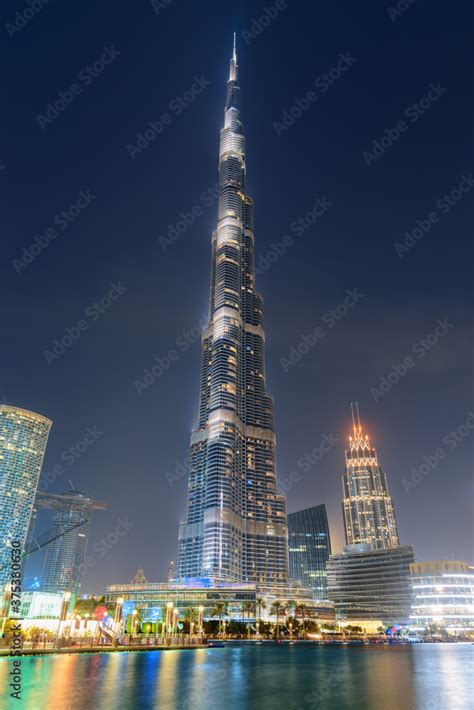 Awesome night view of the Burj Khalifa Tower by lake Stock Photo ...