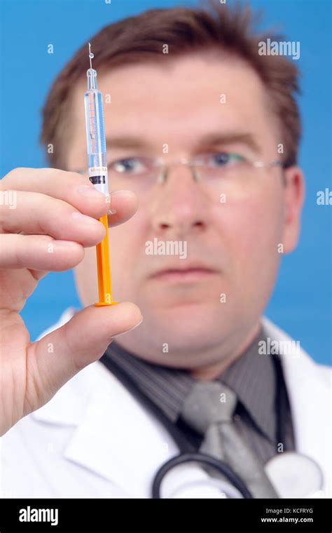 Doctor Preparing Syringe For Injection Stock Photo Alamy