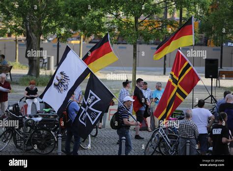 Protesters wave a Wirmer flag, German flags, a Prussian flag and a flag ...