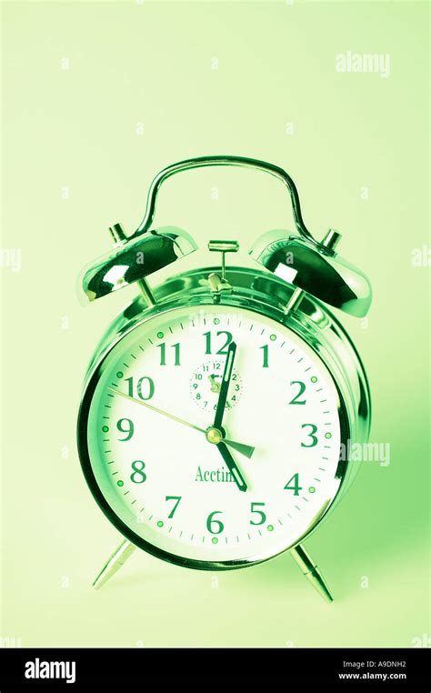 Green alarm clock Stock Photo - Alamy