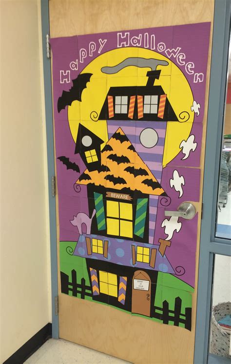 A Door Decorated To Look Like A Halloween House