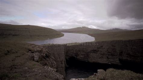 Sorvagsvatn Lake Over The Cliffs Of Vagar Island Establishing Shot