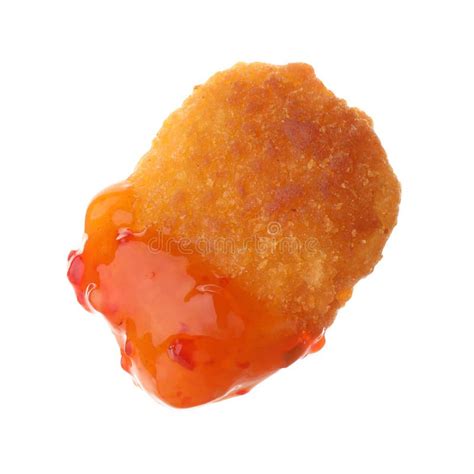 Tasty Nugget Dipped In Hot Chili Sauce Isolated On White Stock Photo