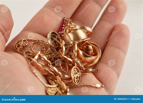 Pile Of Gold Jewellery In Hand Closeup Shot Stock Image Image Of