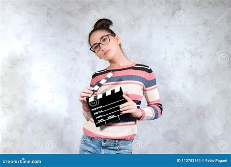 Young Actress Audition Posing With Movie Clapper Board Stock Photo