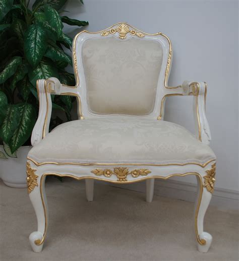 A Large Parisian French Chair In French White Painted Finish With Gold