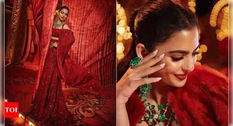 Isha Ambani Stuns In Manish Malhotra S Red Embroidered Lehenga For Mela