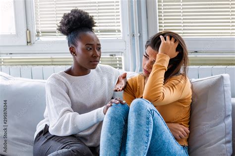 Sad Girl And Supporting Friends Trying To Solve A Problem Two Sad