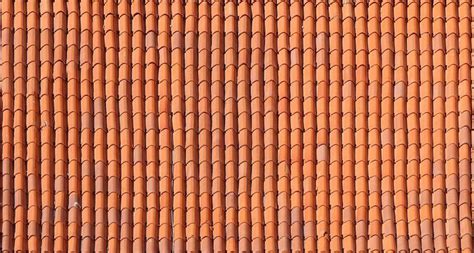 An Orange Tiled Roof With Small Circles On It