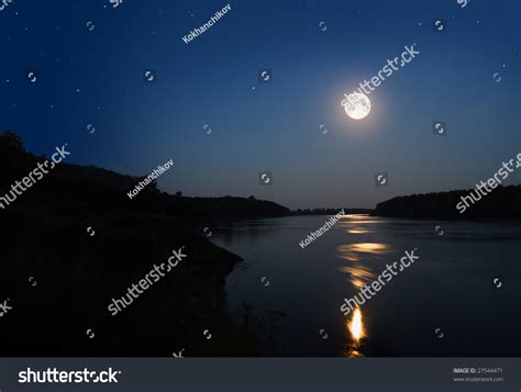 Night Landscape With Moon And Moonbeam In River Stock Photo