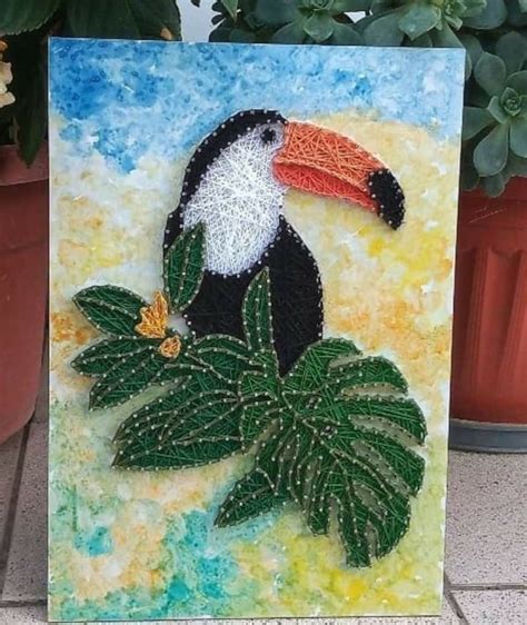 A Painting Of A Toucan Sitting On Top Of A Green Leafy Plant