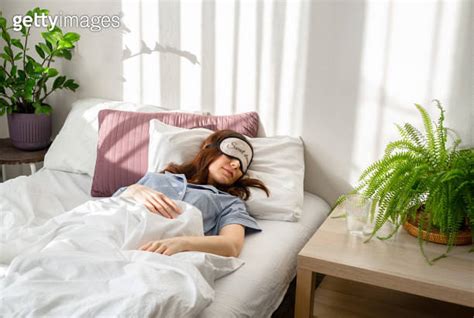 Happy Mornings Beautiful Young Woman Sleeping While Lying In Bed