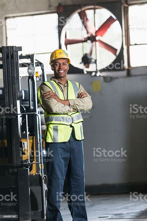 Man Standing Next To Forklift Stock Photo Download Image Now