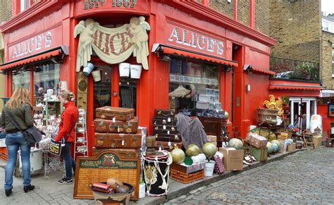 A Red Store Front With Lots Of Items On Display