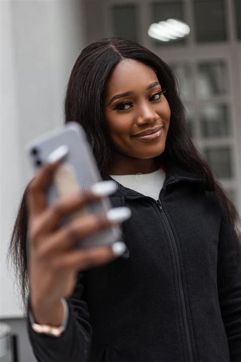 Pretty Happy Young African Woman With Charming Smile In Fashionable