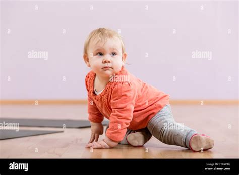 Toddler Sitting On Floor Stock Photo Alamy