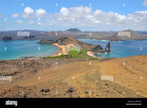 Bartolomé Island, western peninsula with Pinnacle Rock, Santiago Island ...