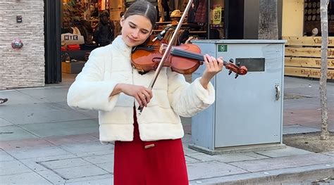 Young violinist Karolina Protsenko plays "Sounds of Silence"