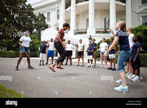 First Lady Michelle Obama and kids double-dutch jump rope during a ...