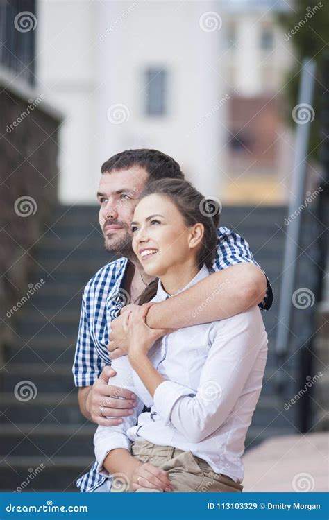 Caucasian Couple Sitting Together Embraced And Relaxing Stock Image