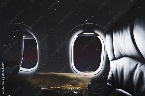 Double exposure, Airplane window with seat and night sky with stars on ...