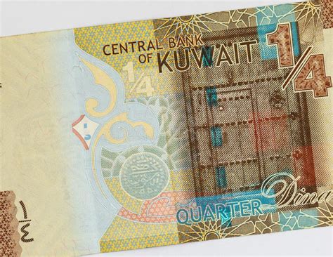kuwaiti quarter dinar banknote featuring  traditional wooden kuwaiti