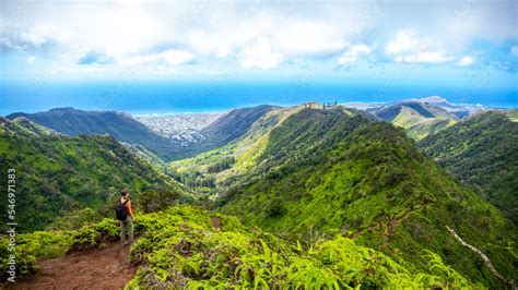 hiker girl enjoys the panorama of oahu island and honolulu in hawaii ...