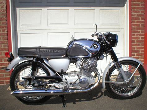 a motorcycle parked in front of a garage door