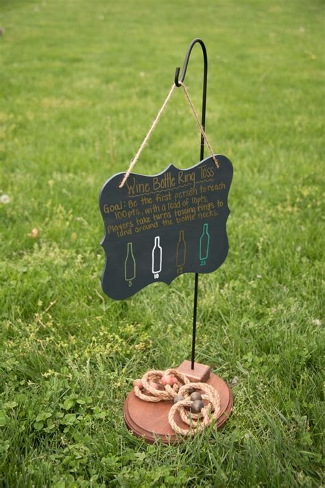 Wine Bottle Ring Toss Sign Setup On The Front Lawn At The Duportail