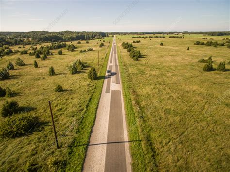 Aerial View Of Car Driving On Road In Countryside Estonia Stock