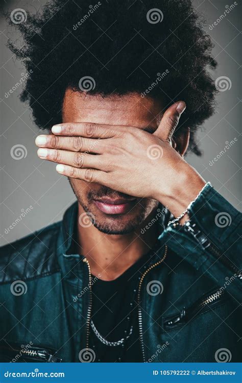 Man Making Facepalm Gesture Covering Eyes While Feeling Ashamed Stock