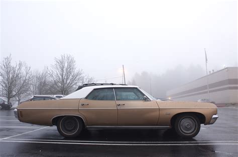 OLD PARKED CARS.: 1970 Chevrolet Impala 4-door hardtop.