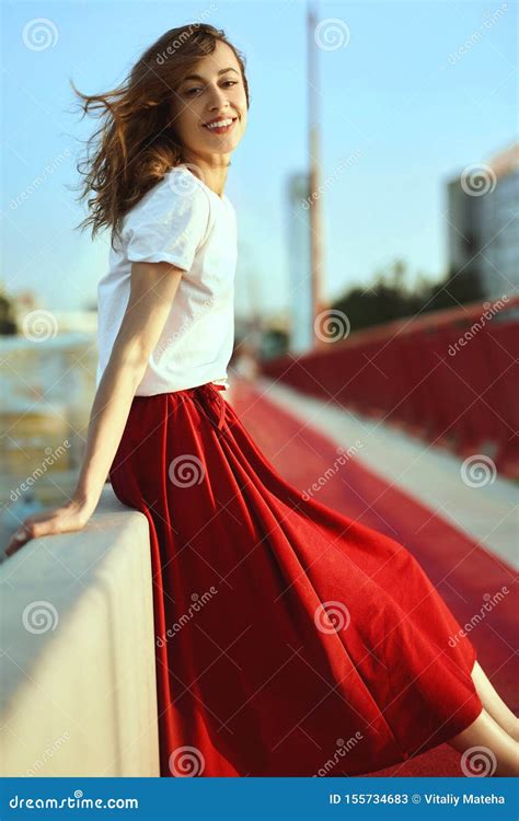 Bright Lifestyle Portrait Of Smiling Pretty Woman In Red Skirt And