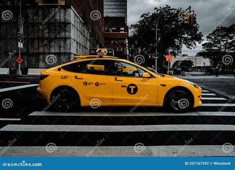 View of Yellow Tesla Taxi Driving by with the New York Urban Background ...