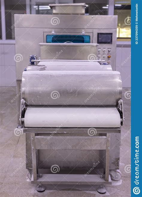 Baker Making Dough For Pastry On Dough Sheeter Dough Rolling Machine