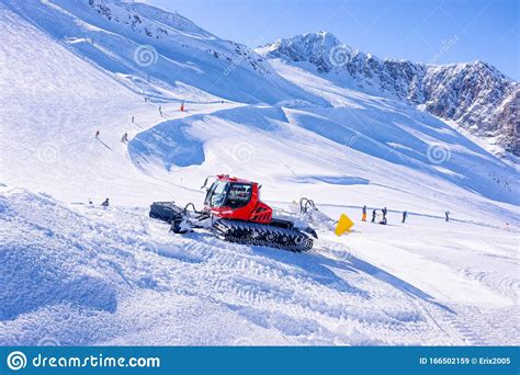 People With Ski And Snowboard At Hintertux Glacier Ratrack Working