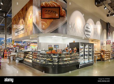 A specialty kiosk inside a modern supermarket, serving coffee, ice ...