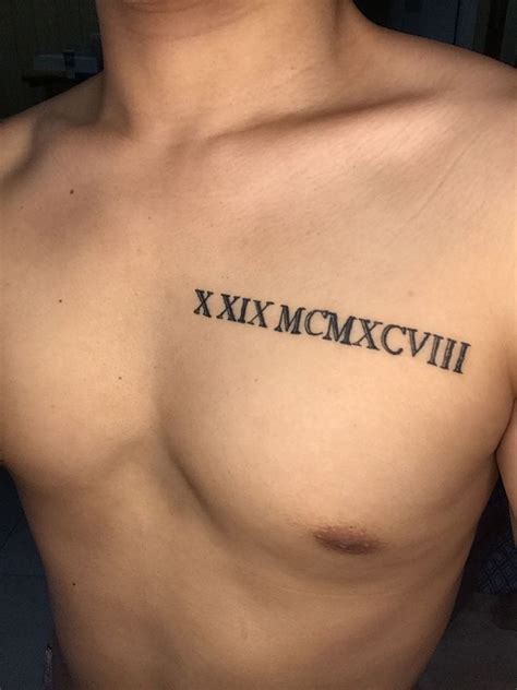 Male Roman Numerals Tattoo Chest