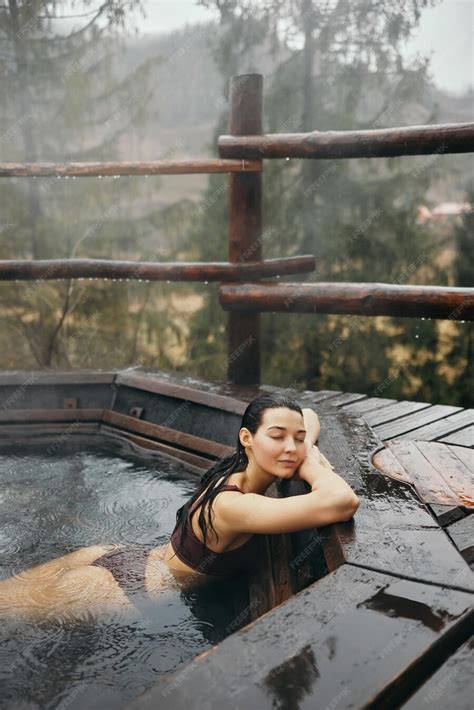 Premium Photo Woman In Bikini Bathing In Japanese Style Bath Outdoors