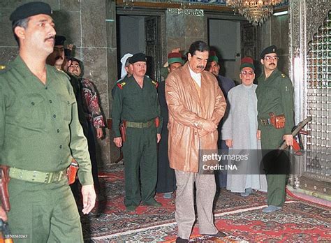 iraqi president saddam hussein prays   shrine  immam ali news