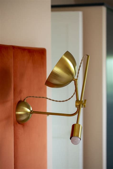 Brass Articulating Wall Light On The Coralie Headboard By Beatrice