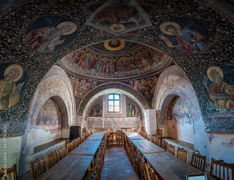 An exquisite ancient church featuring a plethora of detailed paintings ...