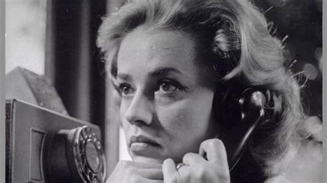 black and white photograph of a woman talking on the phone with her ...