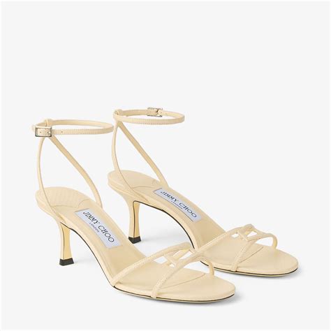 1998 Leo 65 |Ledersandaletten mit Elaphe-Print in Buttermilch | JIMMY CHOO