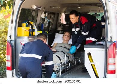 Emergency Medical Staff Team Transporting Patient Stock Photo