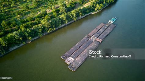 Aerial View Of Tugboat Pushing Barges Up A River Stock Photo Download