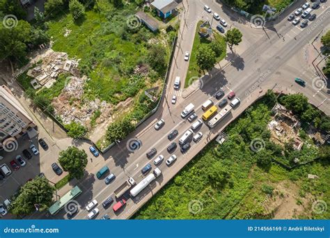 Top Down Aerial View Of Busy Street Intersection With Moving Cars