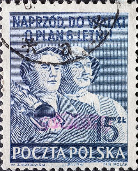 Poland Circa A Post Stamp Printed In Poland Showing Two Workers